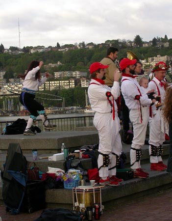 Morris dancers paying no attention to the hula lady