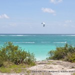 View of the Caribbean and kite surfer at Tulum ruins.