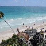 Busy beach at Tulum ruins.