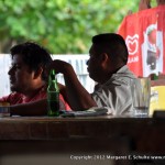 Locals enjoy a beer at the bar.