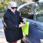 Mary decorates her car for the parade