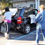 Isaac and Dana decorate their car for the parade