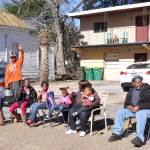 Bystanders waving at the parade