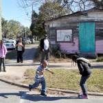 A little boy dashes for a piece of candy