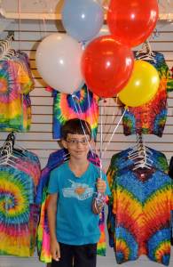 Little boy with balloons inside the store