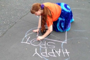 Drawing a happy spot in chalk