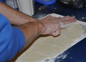 Barry cutting the noodles on the silicone mat.