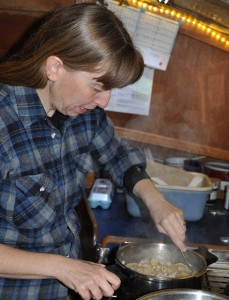 Margaret stirs in leftover turkey from Christmas dinner.