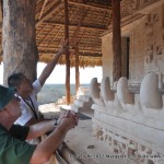 Our guide points out details of the tomb carvings at Ek'Balam to Philip.