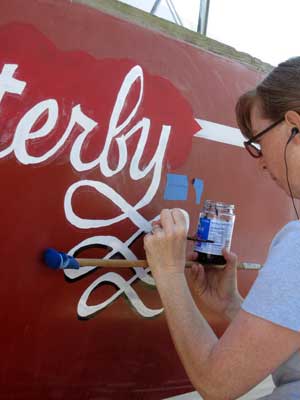 Meps paints the name on Flutterby