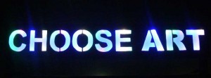 The CHOOSE ART sign at night