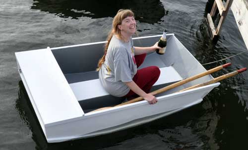 Margaret Meps Schulte christens her Tortoise dinghy