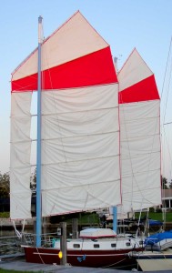 Hoisting the sails on a calm day at the dock