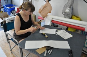 Margaret attaching tape to batten pockets