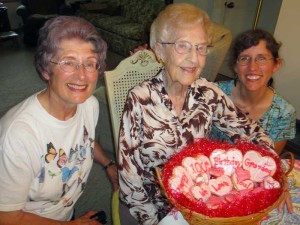 Sharon, Loraine, and Julie with 100th birthday cookies