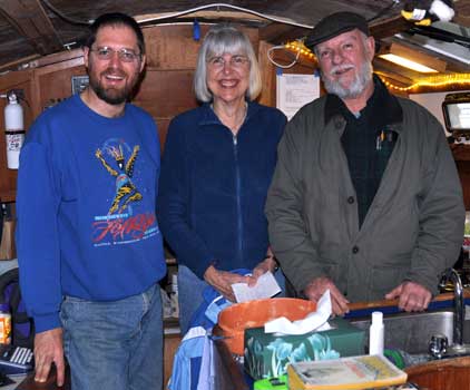 Barry, his aunt Jeanine, and her friend Jim aboard Flutterby, after eating some of the giant cookie