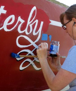 Painting Flutterby's name with a marl-stick