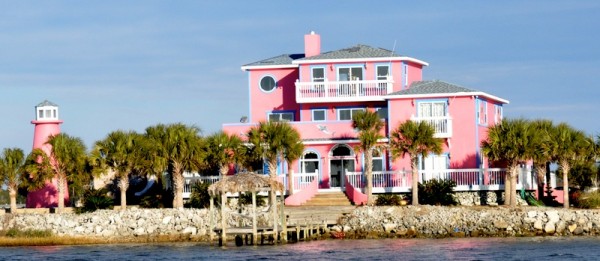 The infamous pink house with the palm trees and lighthouse